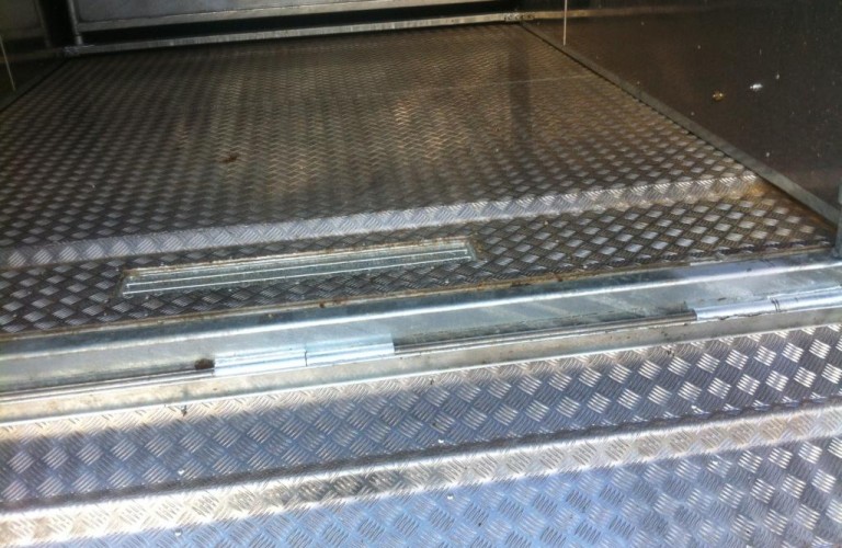 Waste collection tank with external release valve